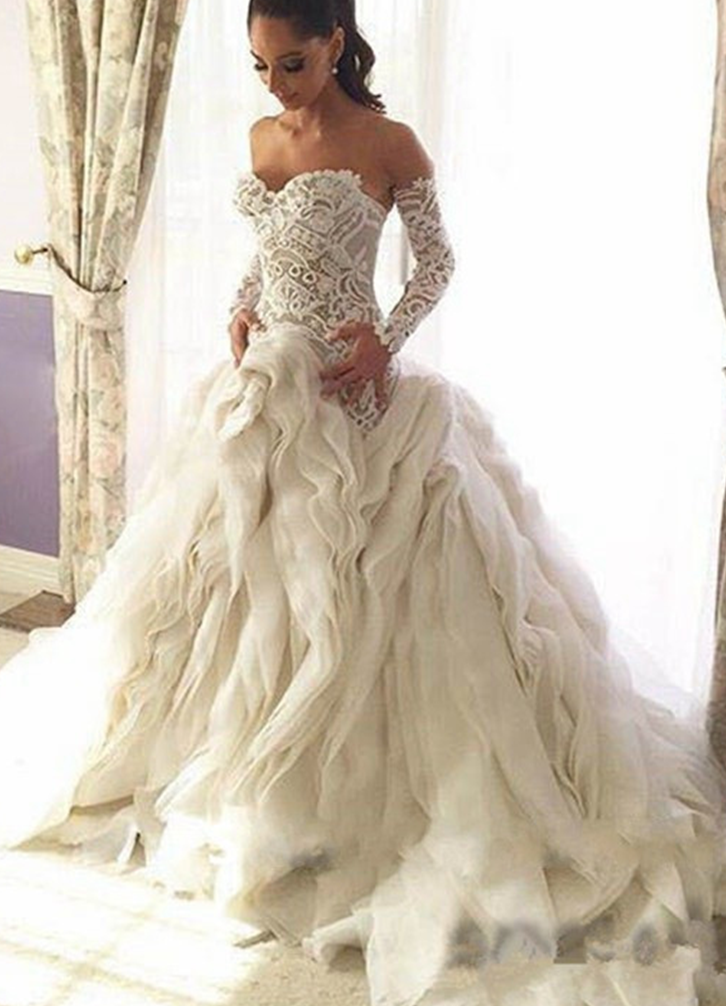 Wedding dress with long sleeves and ruffle bottom Wedding dress with long sleeves and ruffle bottom